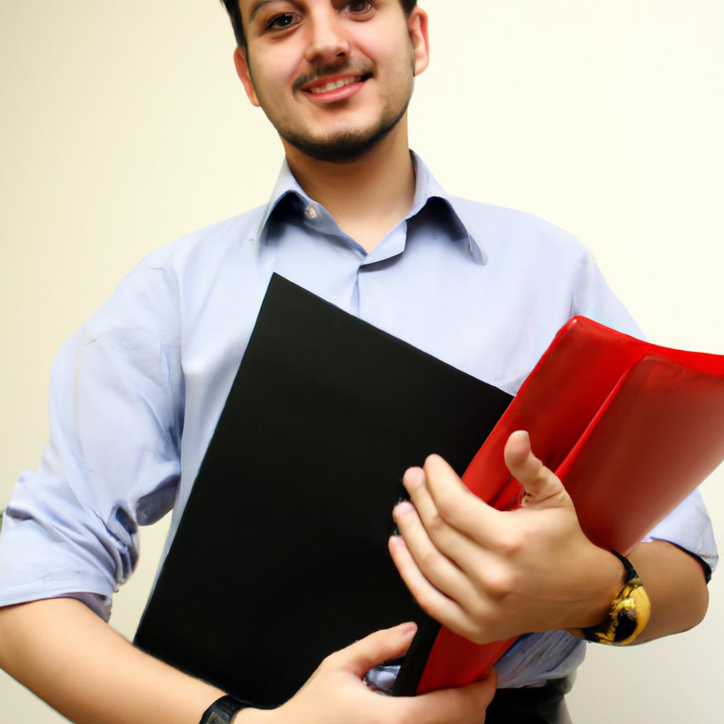 Person holding business documents, smiling